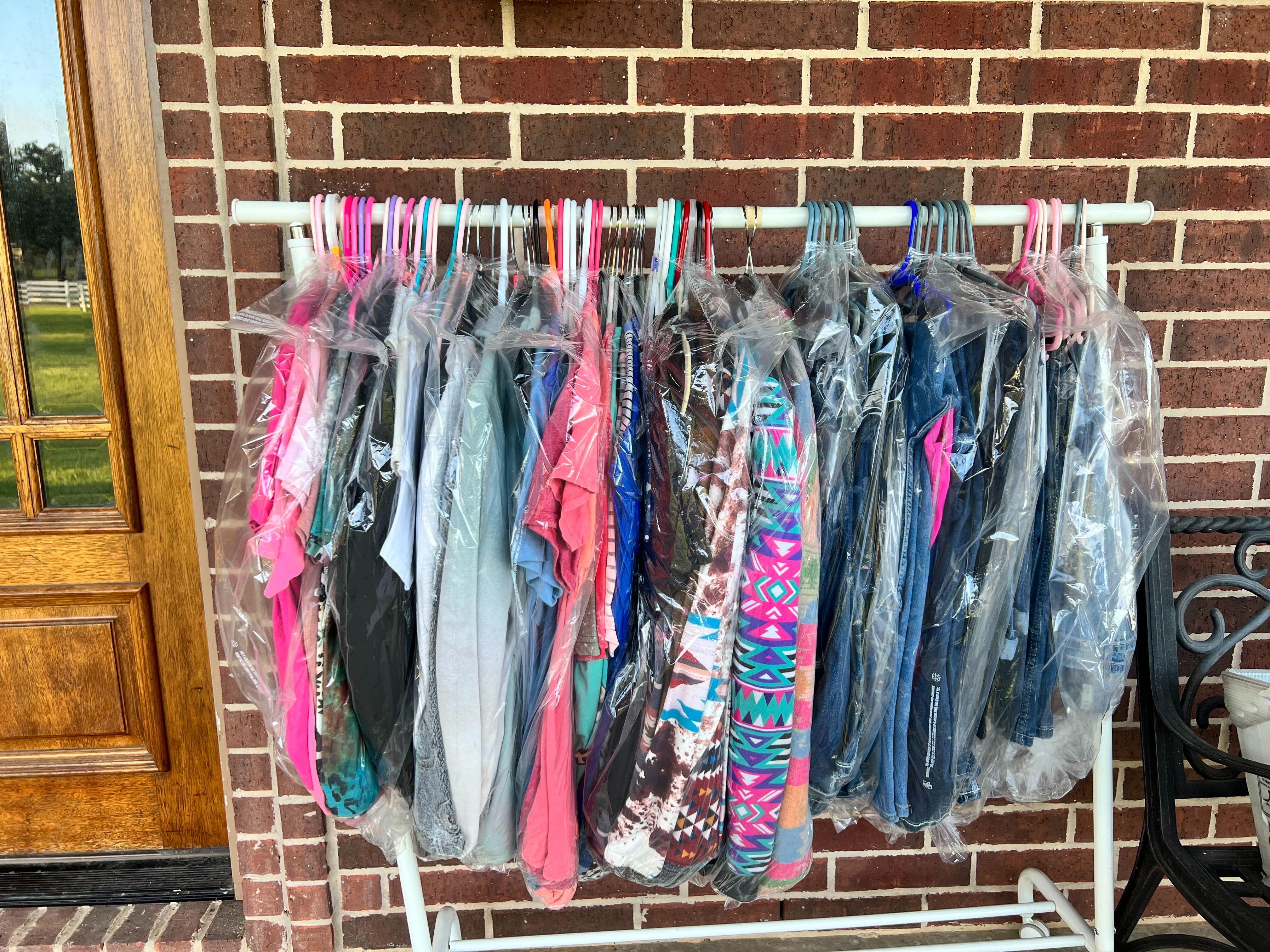 Delivered hung up laundry on a rack outside the clients front door